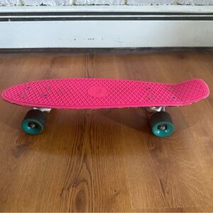 Pink Penny Skateboard with Green Wheels
